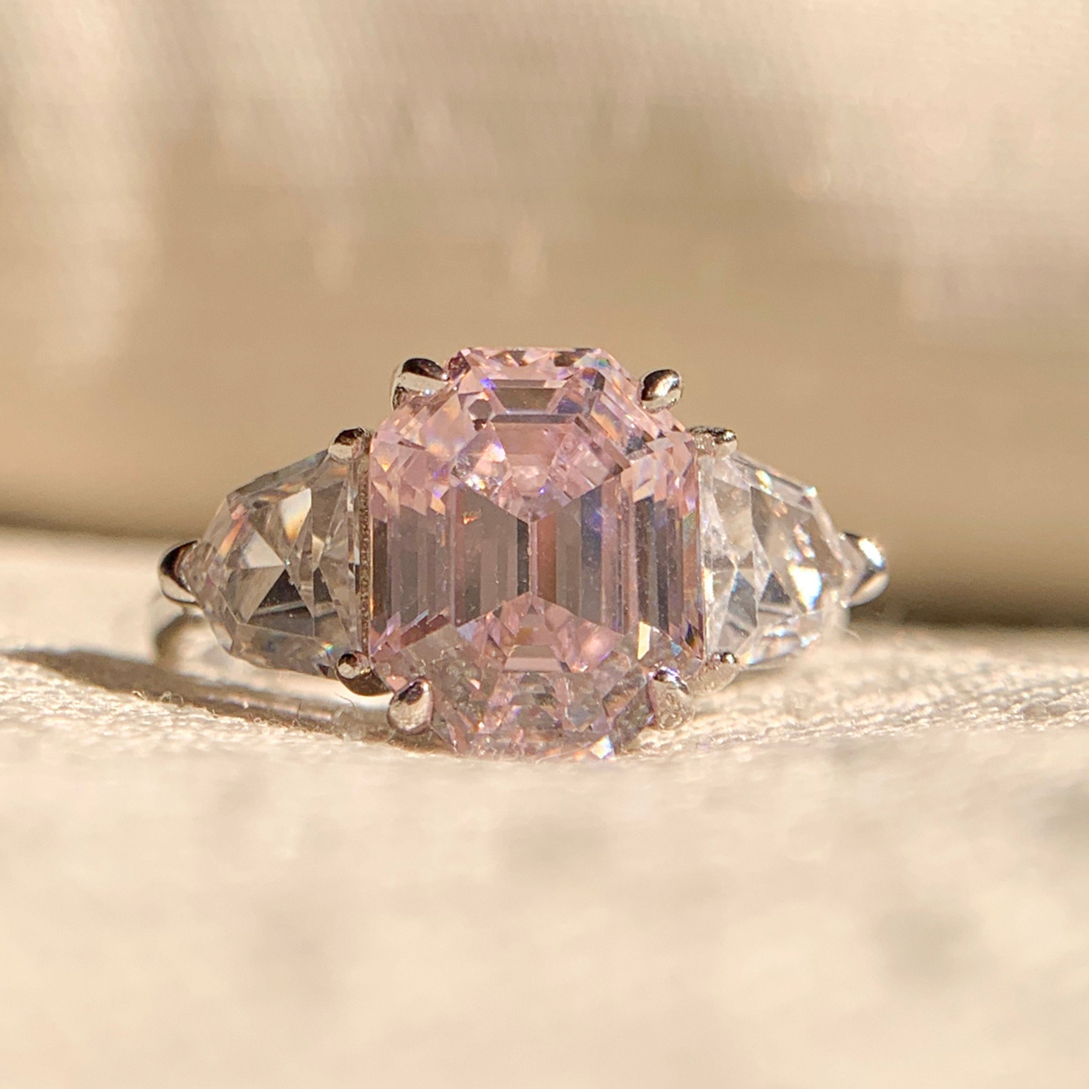 "Emerald Cadillac Shape Three Stone Engagement Ring in white gold"